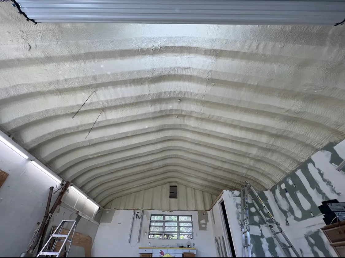 Spray polyurethane foam applied to the underside of a metal roof deck in Brooklyn Center